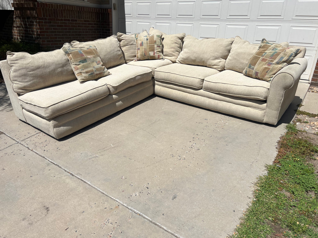 Large Beige L-Shaped Comfy Sectional with Throw Pillows