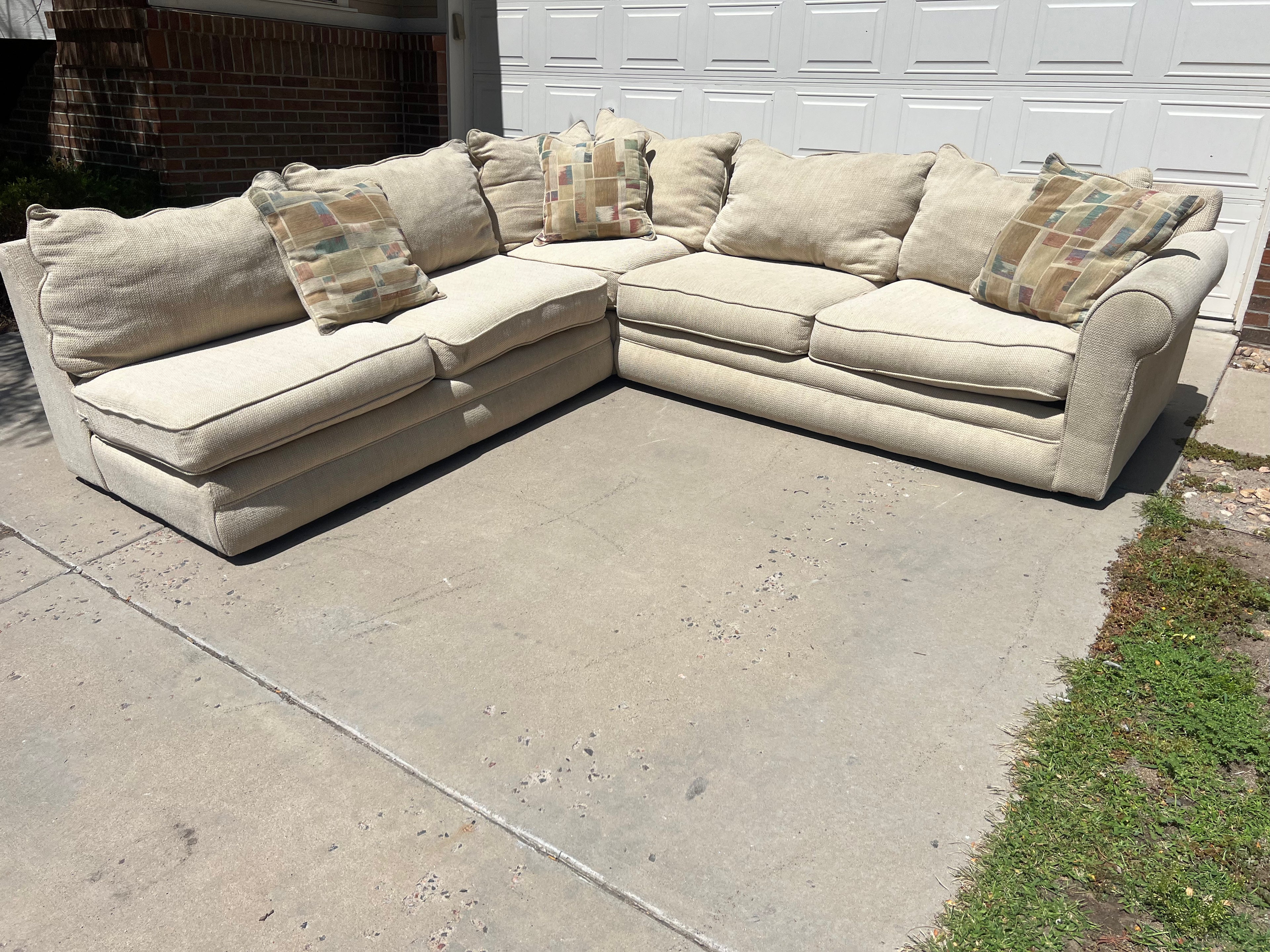 Large Beige L-Shaped Comfy Sectional with Throw Pillows