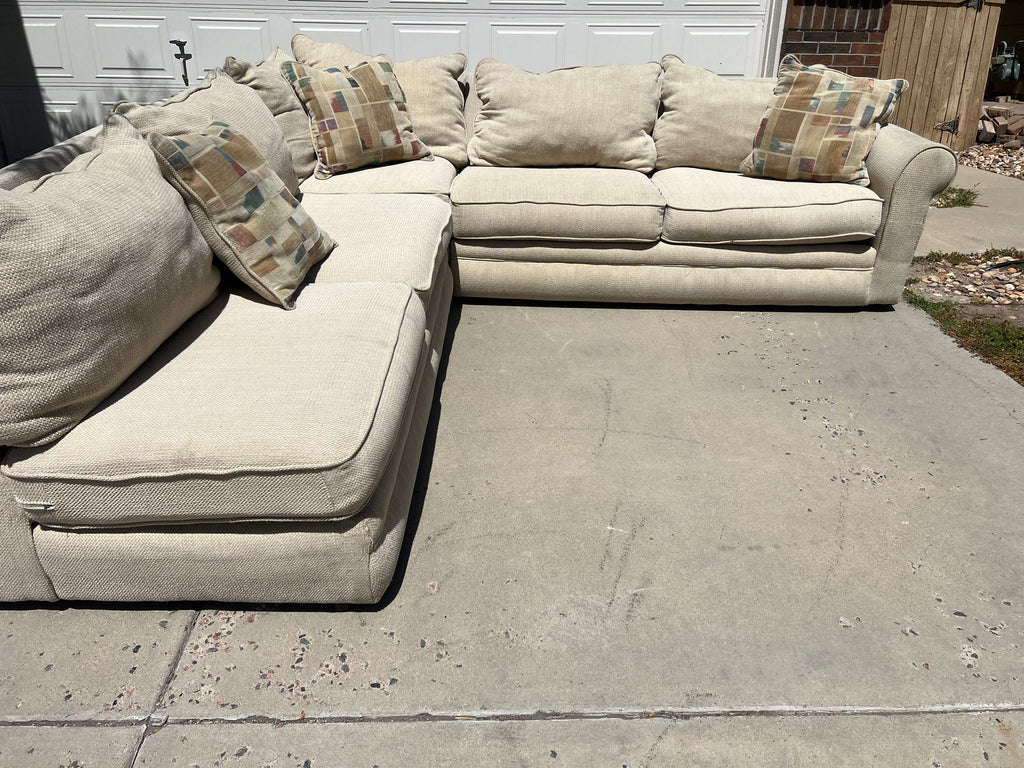 Large Beige L-Shaped Comfy Sectional with Throw Pillows