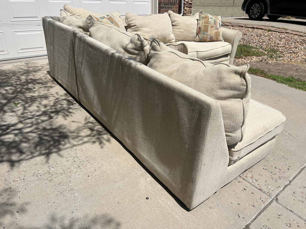 Large Beige L-Shaped Comfy Sectional with Throw Pillows