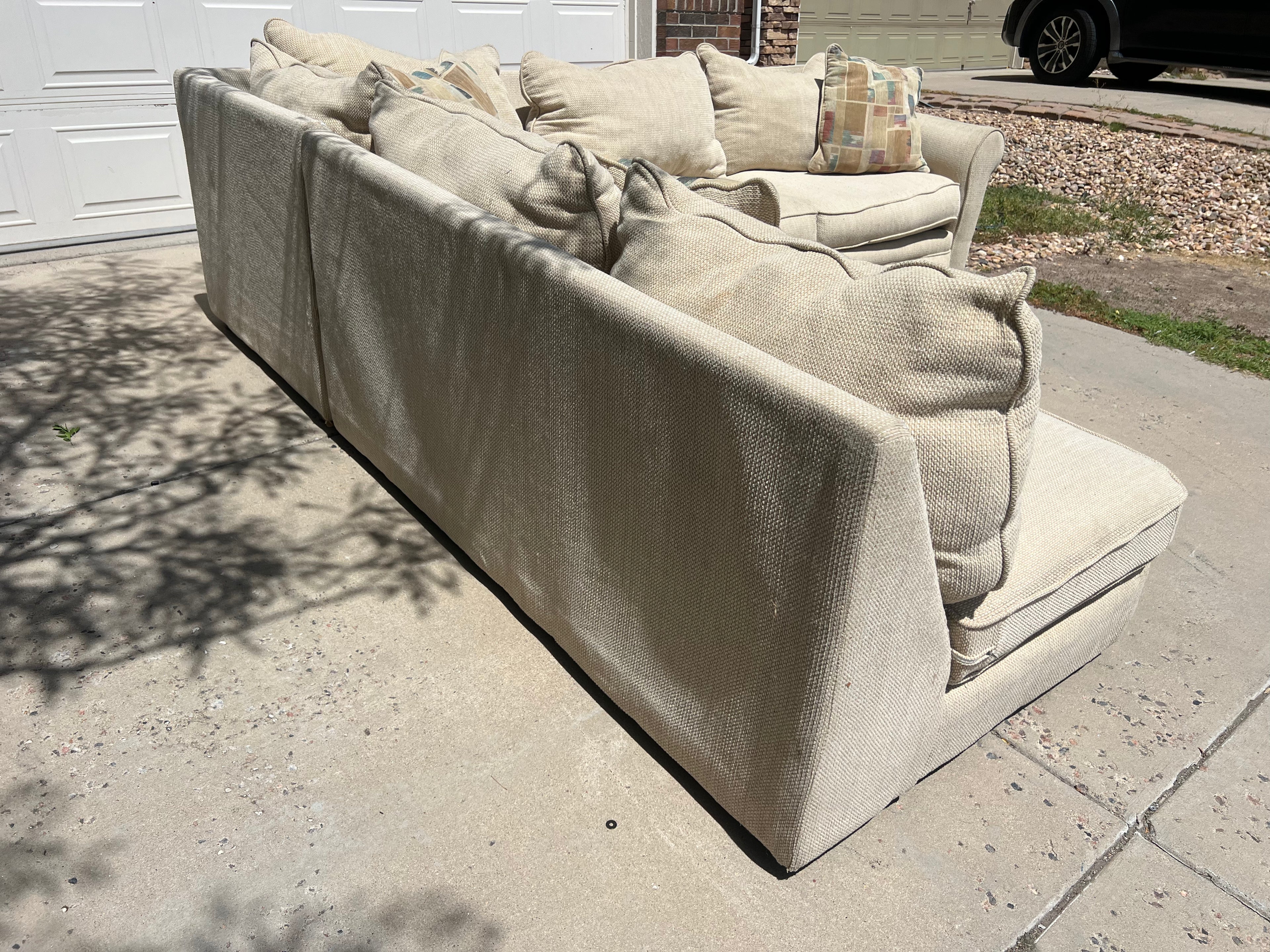 Large Beige L-Shaped Comfy Sectional with Throw Pillows