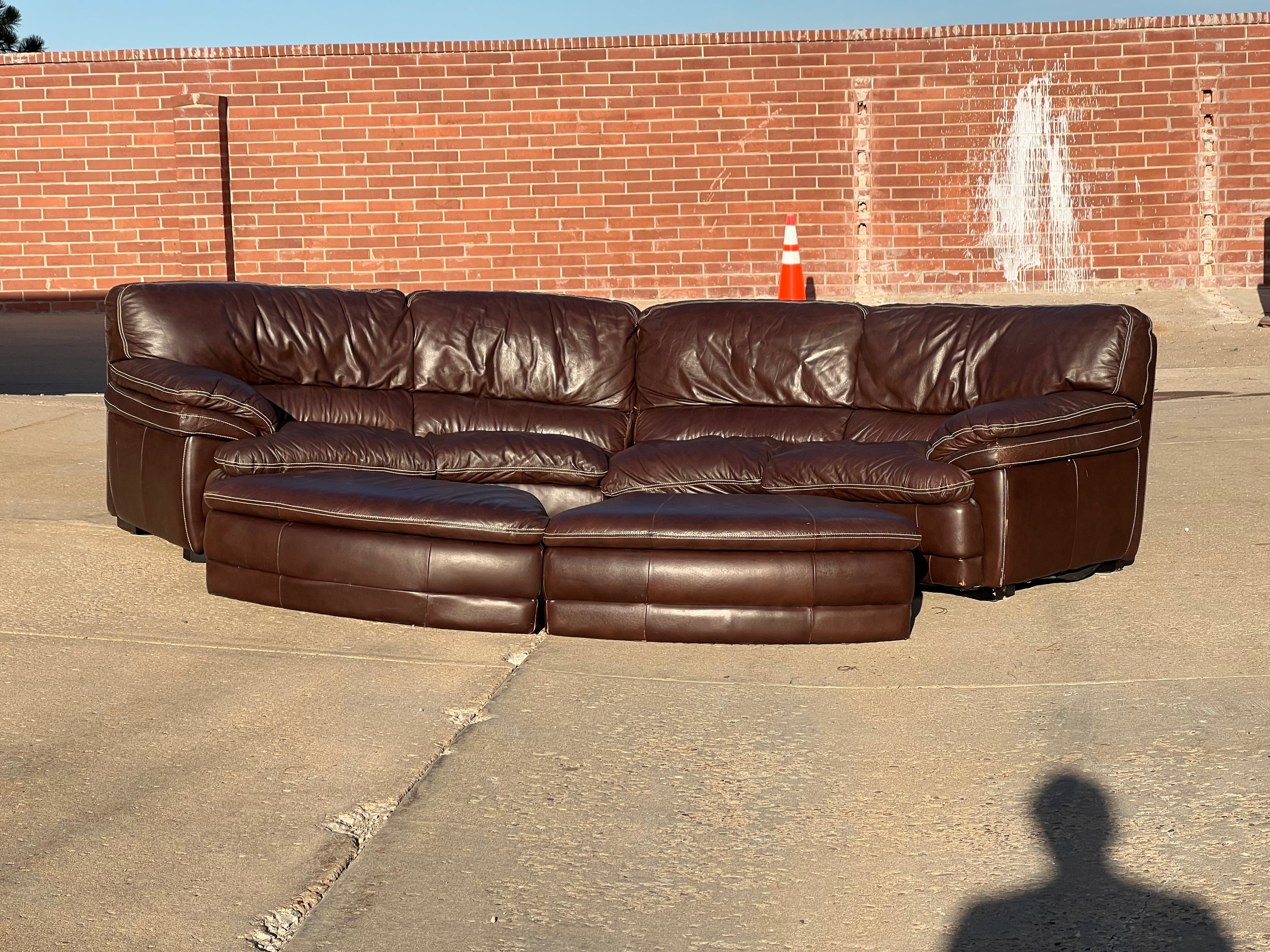 Curved Leather Sectional with 2 Storage Ottomans