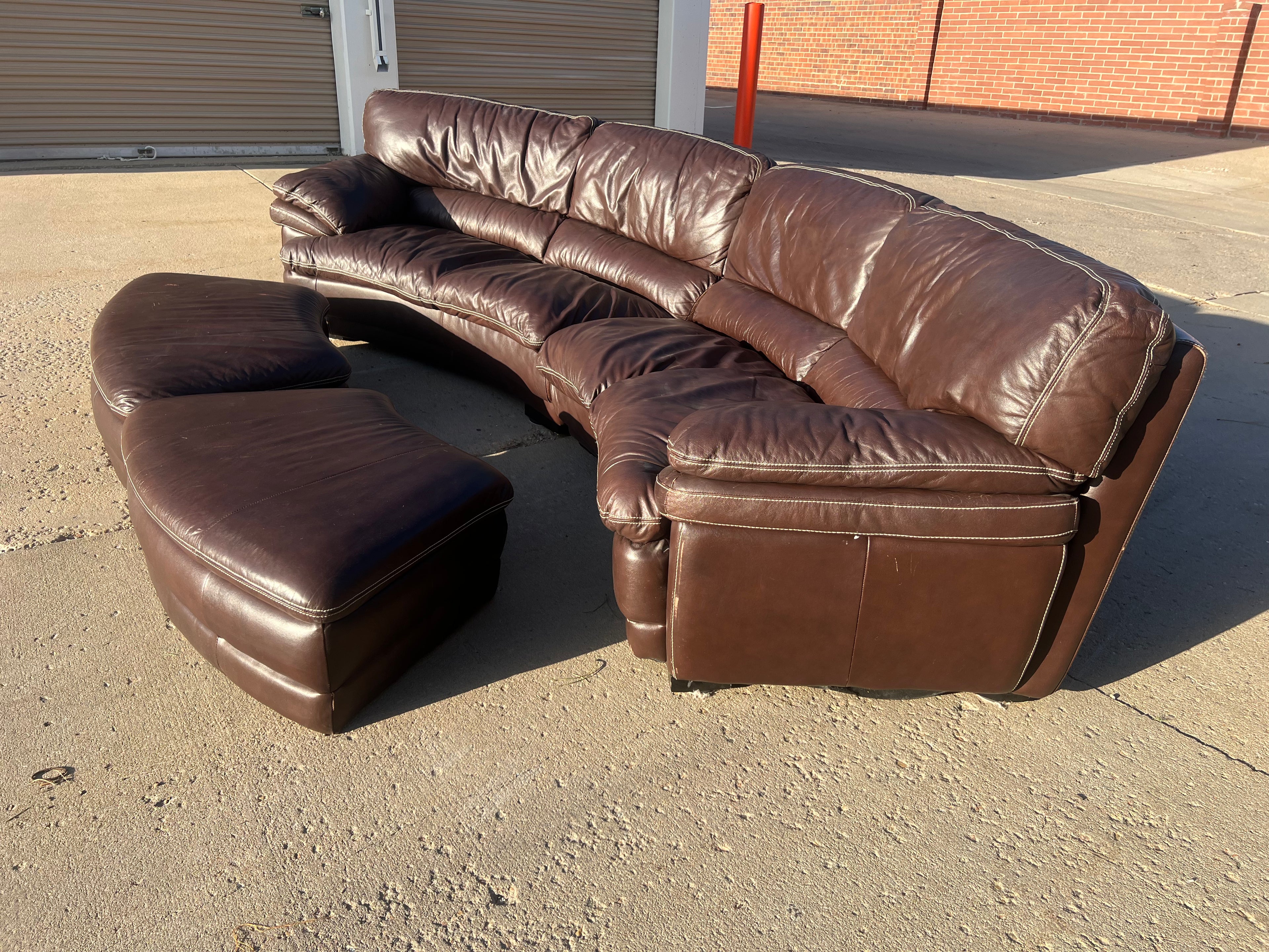 Curved Leather Sectional with 2 Storage Ottomans