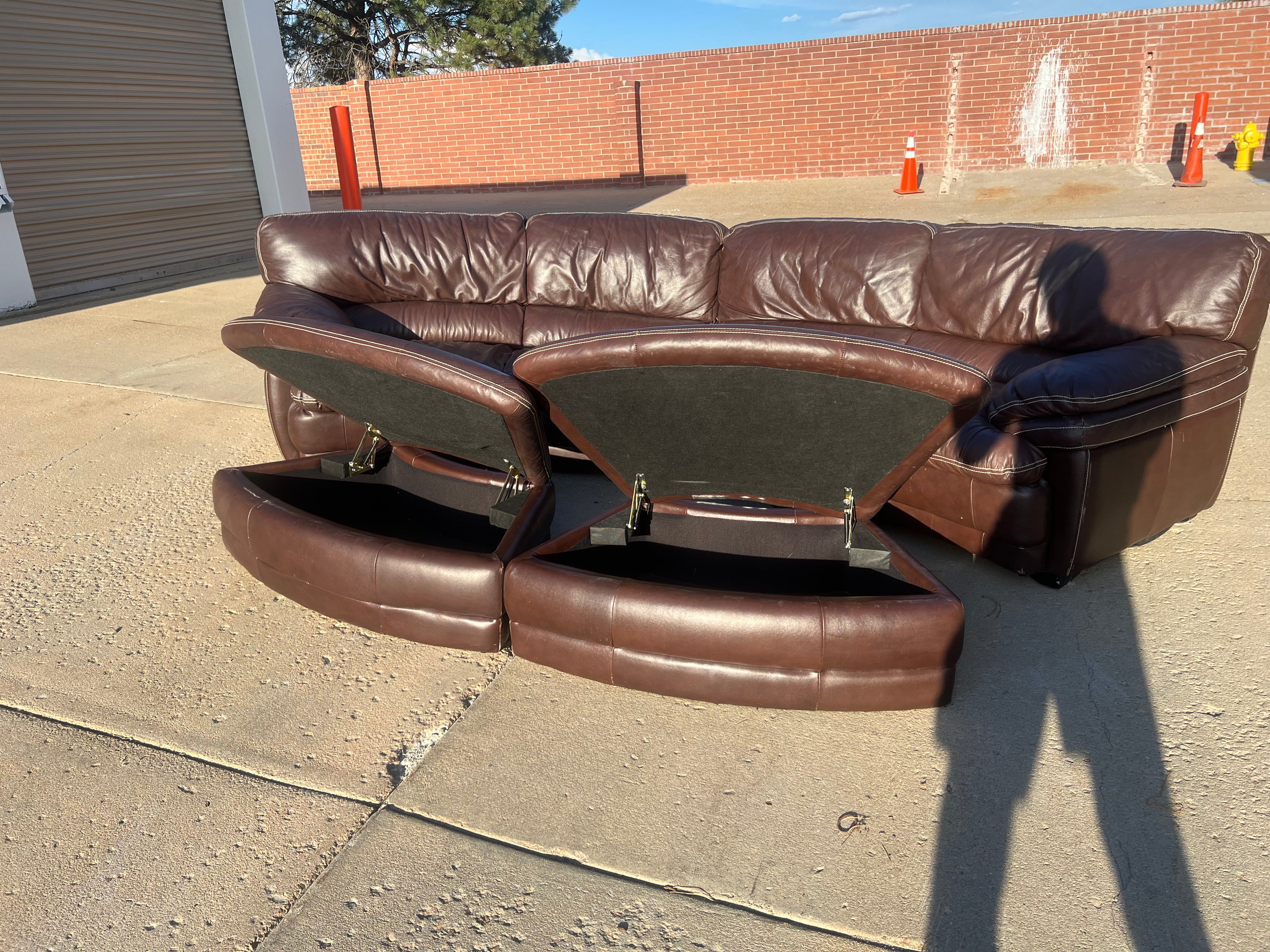 Curved Leather Sectional with 2 Storage Ottomans