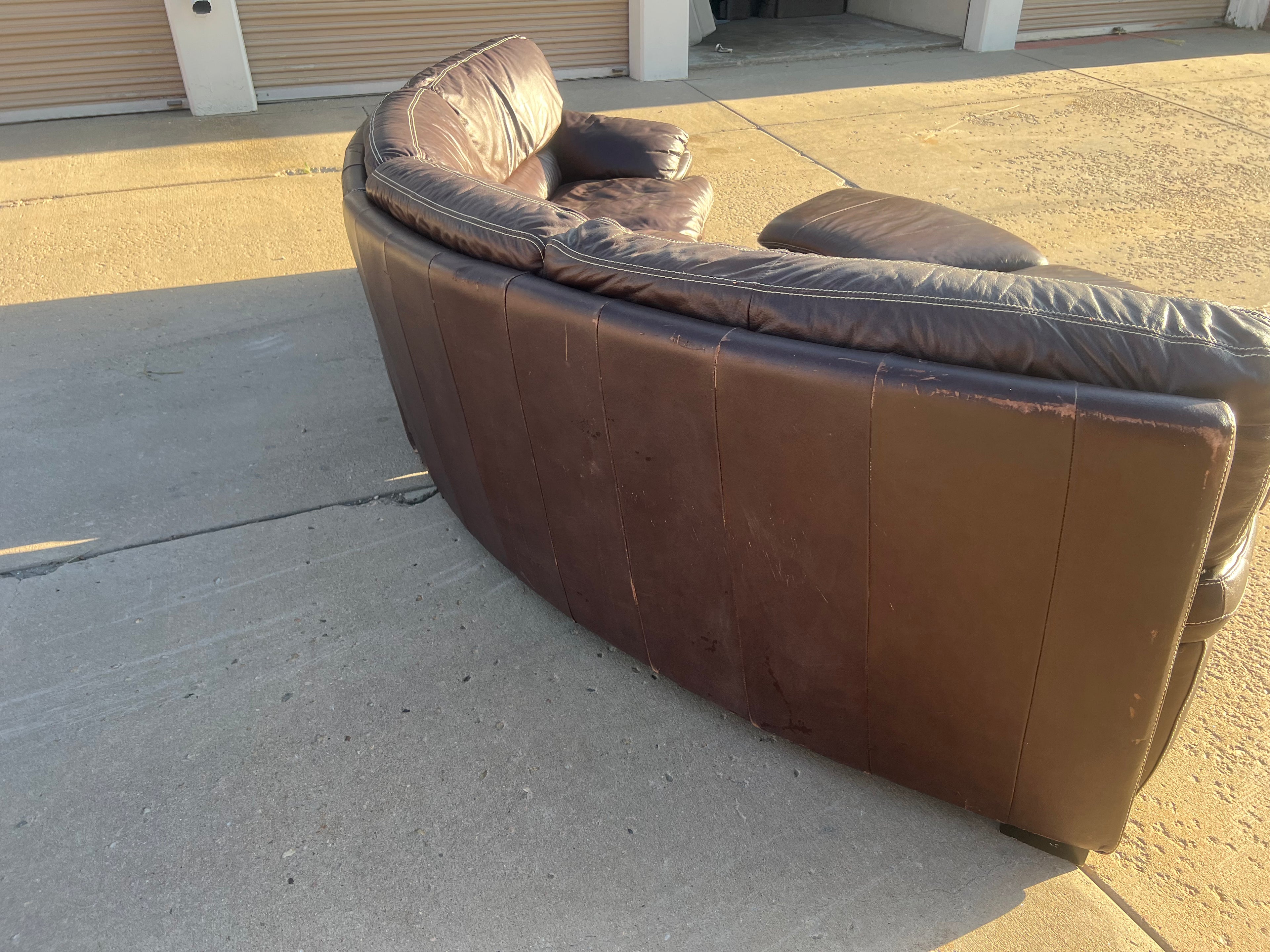 Curved Leather Sectional with 2 Storage Ottomans