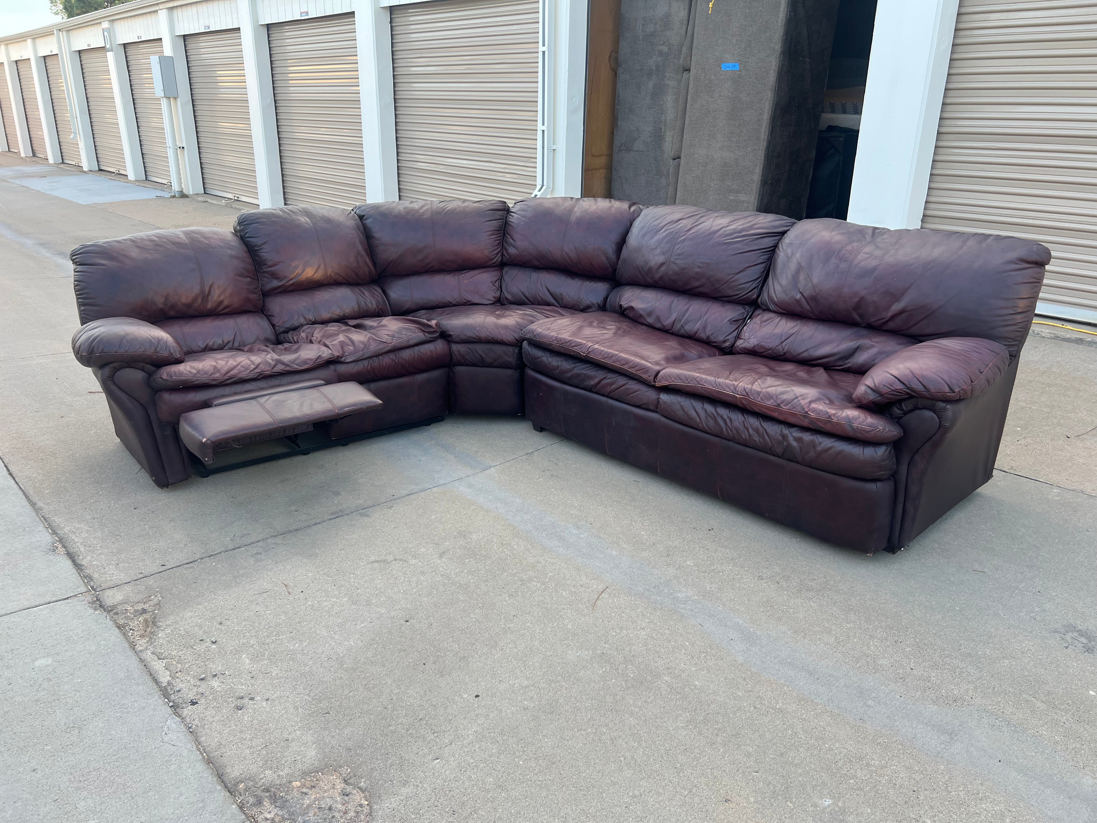 Leather L Shaped Reclining Sectional with Hide-a-bed.