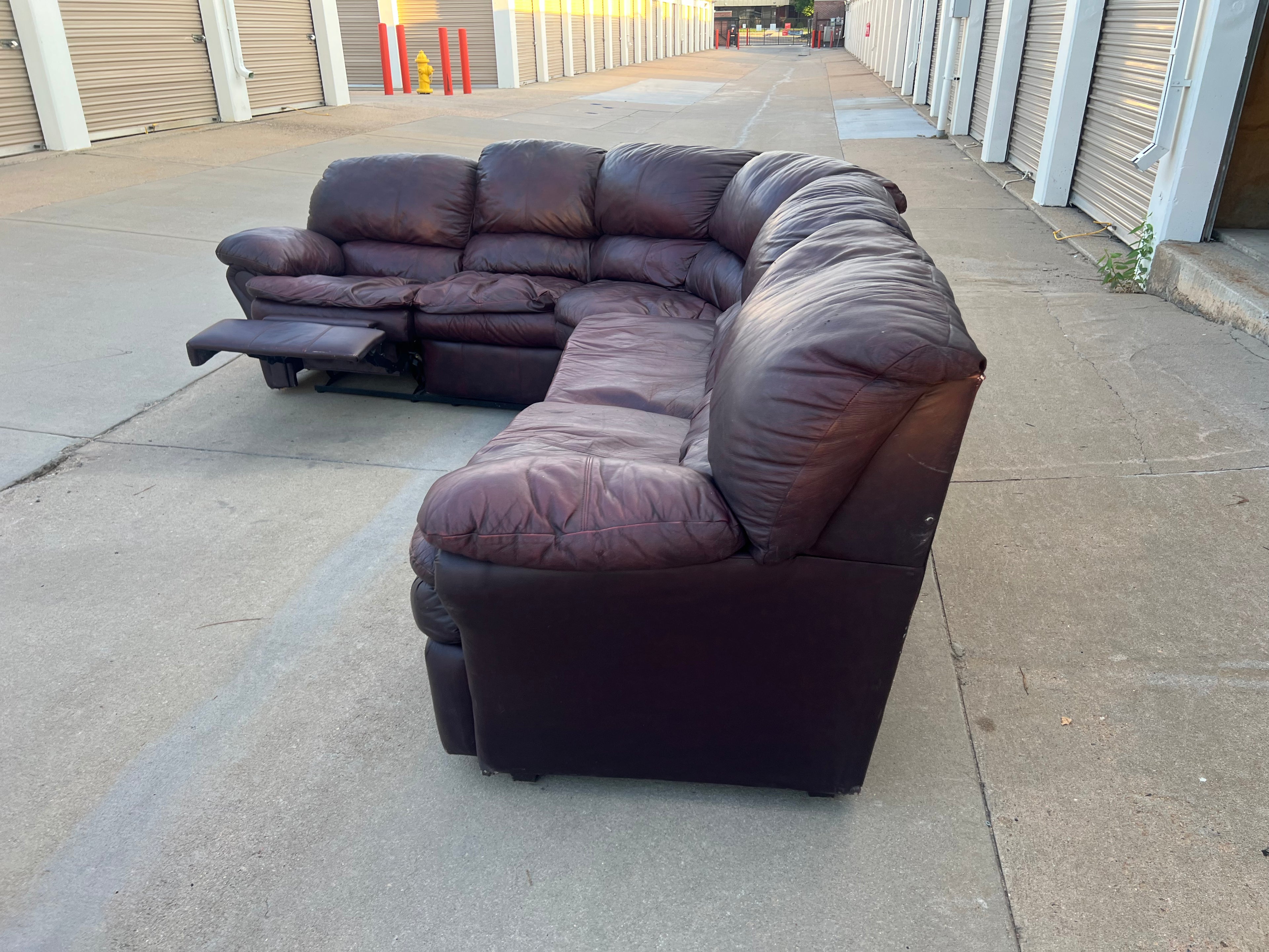 Leather L Shaped Reclining Sectional with Hide-a-bed.