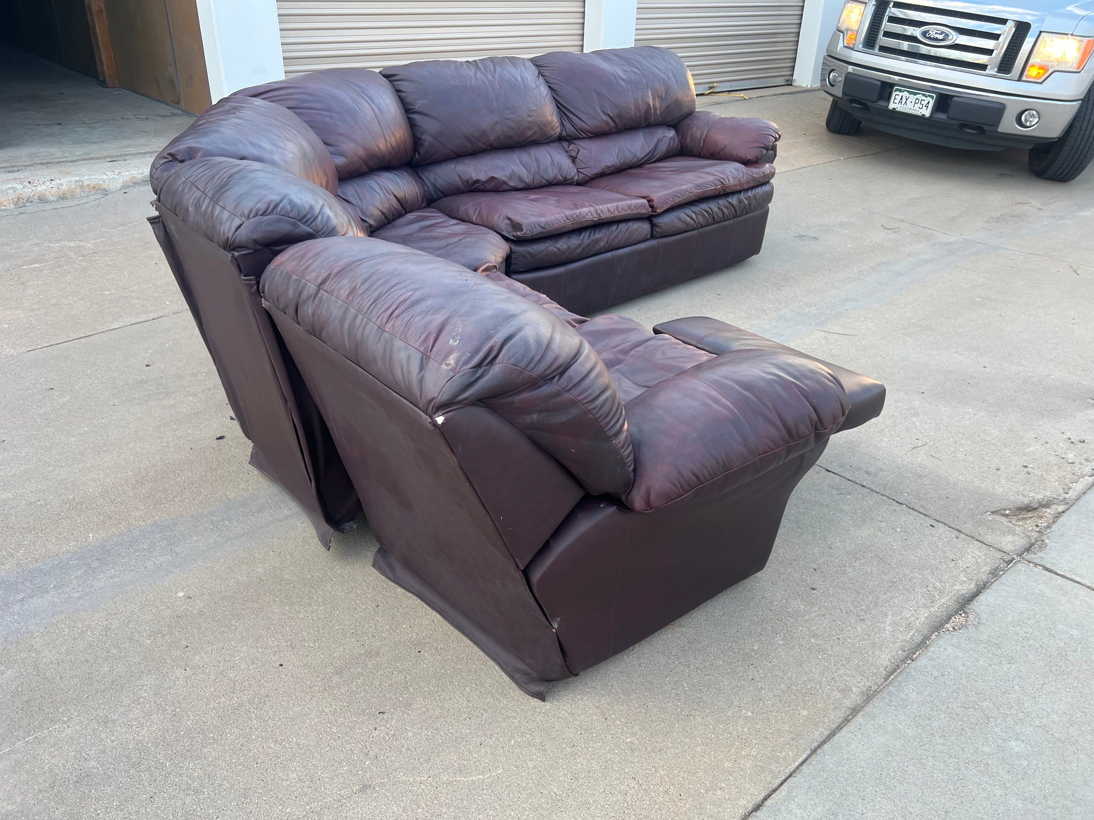 Leather L Shaped Reclining Sectional with Hide-a-bed.