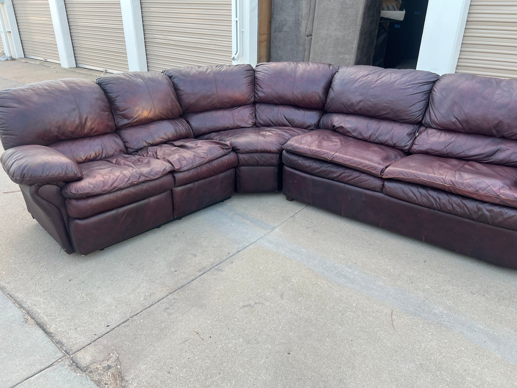 Leather L Shaped Reclining Sectional with Hide-a-bed.