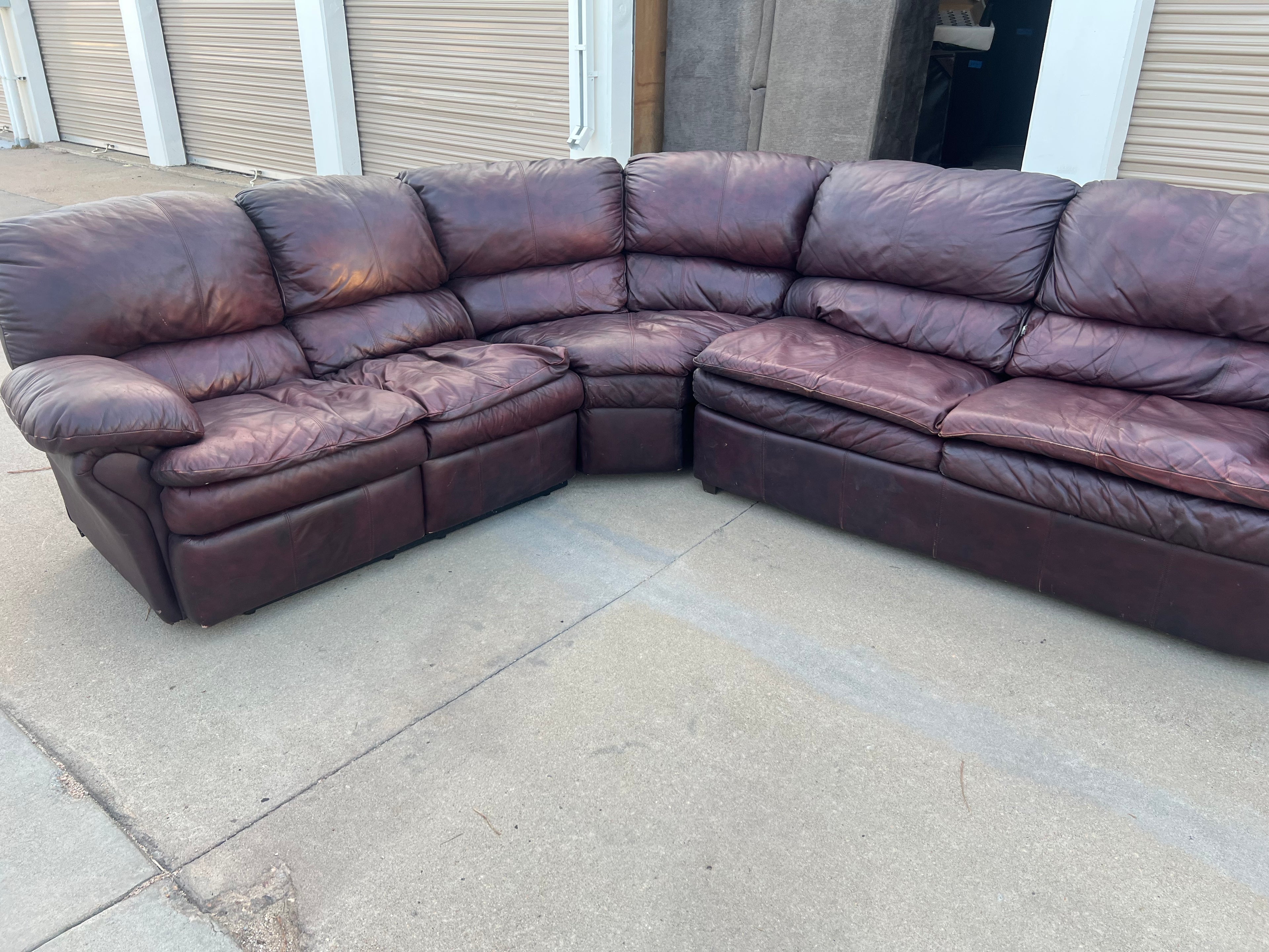 Leather L Shaped Reclining Sectional with Hide-a-bed.