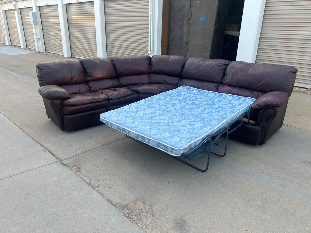 Leather L Shaped Reclining Sectional with Hide-a-bed.