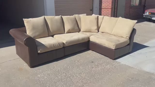 Leather Modular Sectional with Beige Cushions
